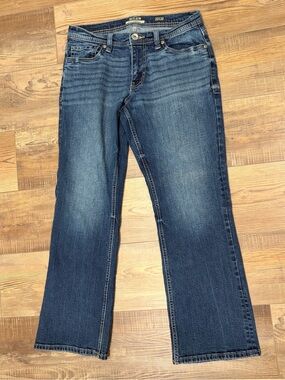 Reclaimed Vintage Blue Boot Cut Jeans with Subtle Fade
